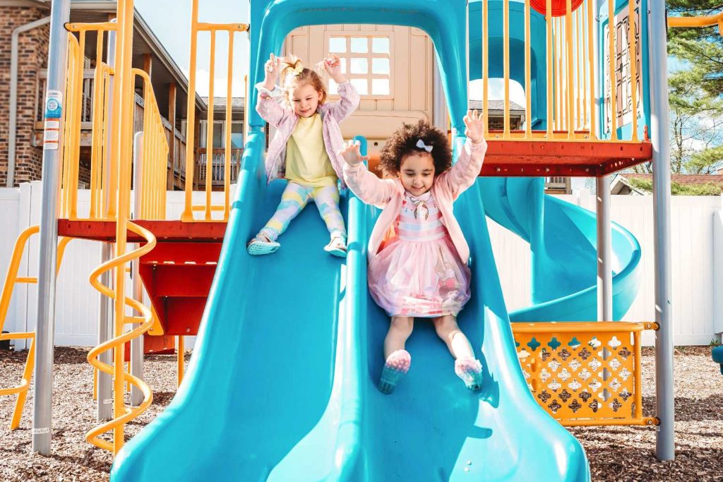 Where We Work - Playground - Children on a slide